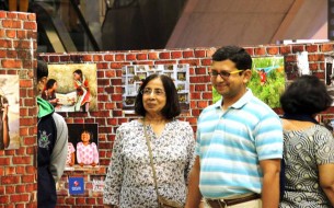 A family sharing a light moment at the exhibition