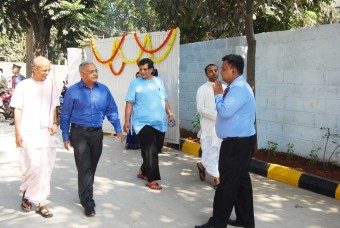 Our CEO, Shri Shridhar Venkat (second from left) and Shri Stoka Krishna Dasa, Governing Body Commissioner, ISKCON (left) entering our kitchen premises 